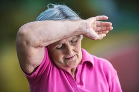 Senior woman sweating and feeling tired