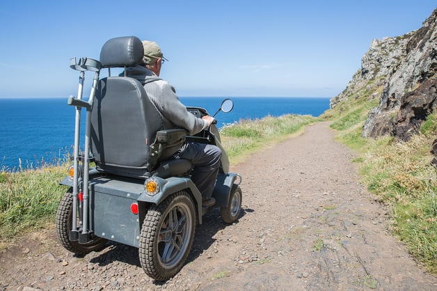 senior-man-riding-a-mobility-scooter